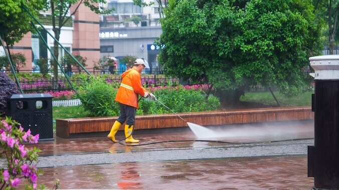 a Man Cleans Sidewalk Royal Wash
